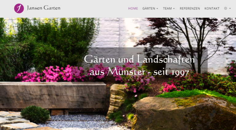 Eine wunderschöne Gartenszene mit farbenfrohen Blumen, Grünpflanzen und Natursteinelementen, die das Fachwissen von Jansen Garten bei der Landschaftsgestaltung unter Beweis stellt.